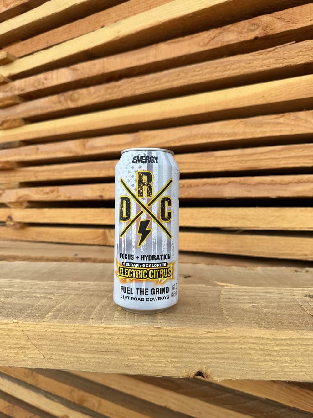 Electric Citrus can on a stack of lumber